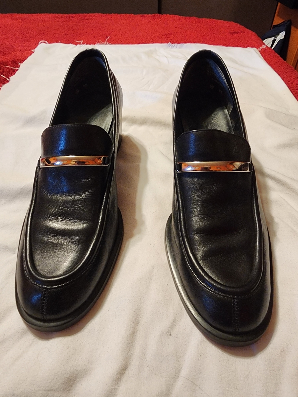 Black Leather Slip-On Loafers with Gold Accent
